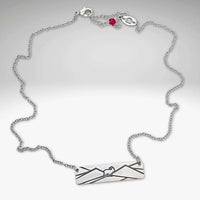 Mountain Goat Necklace in Matte Silver on adjustable rolo chain, perfect for nature enthusiasts.