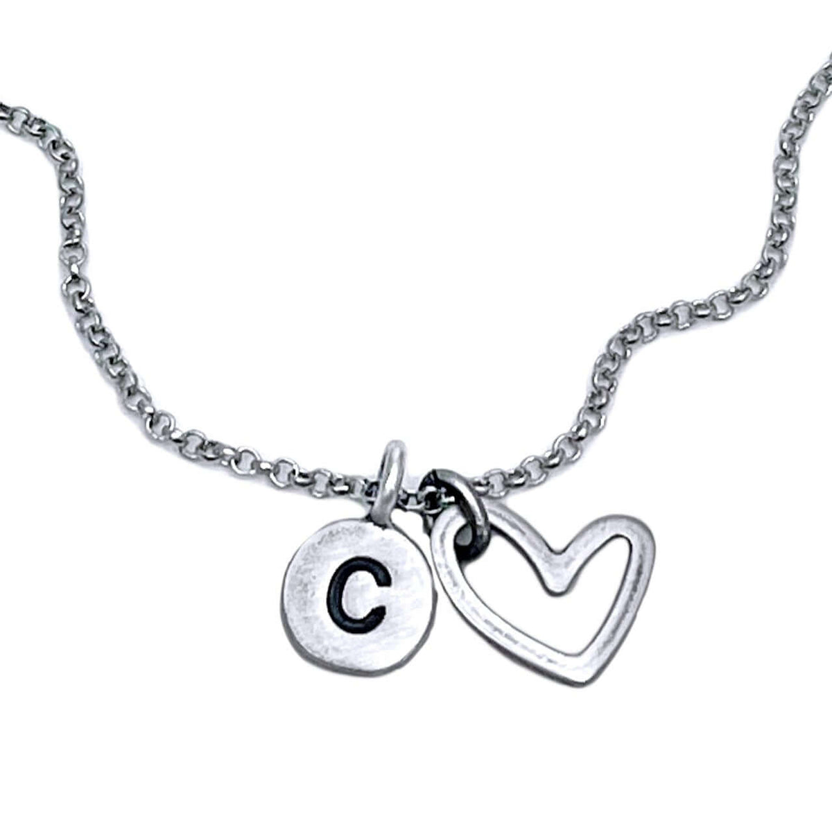 Open Heart Initial Necklace featuring a silver heart charm and initial "C" pendant on a delicate chain.