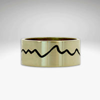 antique brass ring with Grand Tetons Montains etched all the way around