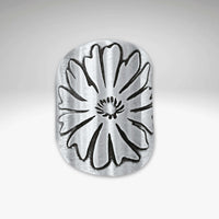 Close-up of a matte silver adjustable ring featuring a bitterroot flower design, handcrafted in Montana.