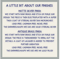 Information about matte silver and antique brass finishes for earrings, including details on materials and plating.
