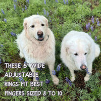 Two fluffy white dogs sitting in a field, with text about adjustable rings fitting fingers sized 8 to 10.