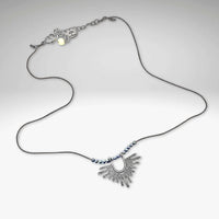 Sunbeam Necklace featuring geometric design, hematite beads, and adjustable silk cord from 16" to 18".