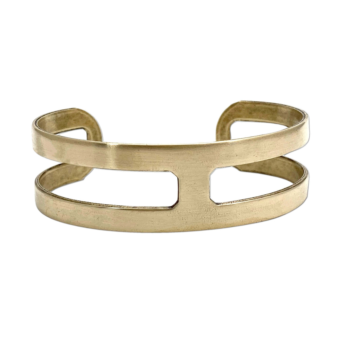 Wide Open Cuff Bracelet in antique brass, a minimalist adjustable design perfect for layering with other jewelry.