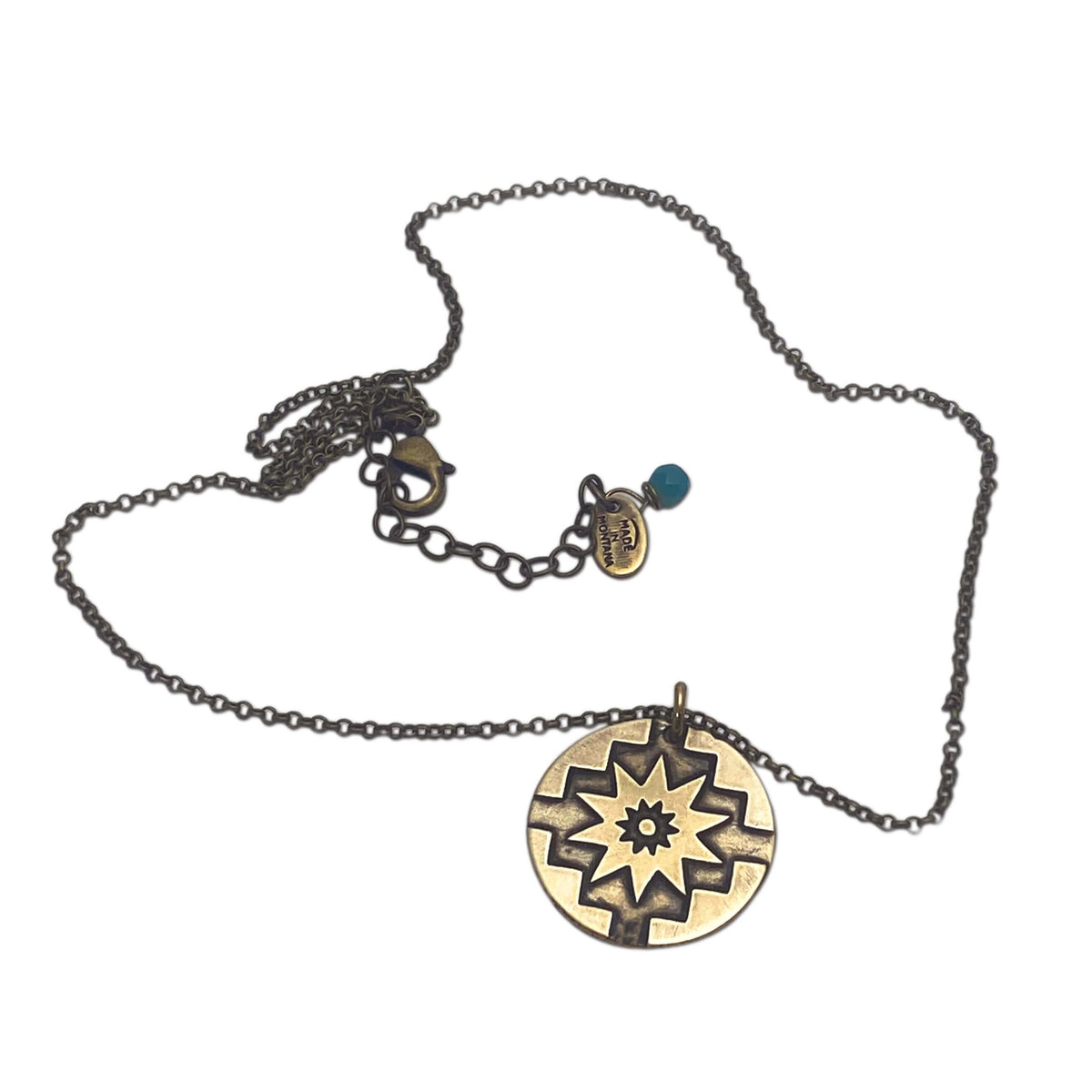 Northstar Necklace in antique brass finish featuring a star disk pendant and adjustable chain, symbolizing courage and optimism.