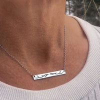 Antler Bar Necklace worn on a neck, showcasing its sleek design and elegant finish.