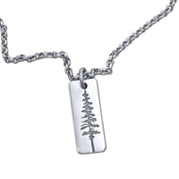 Elegant Pine Tree Necklace in matte silver with a Ponderosa Pine pendant on a chain.