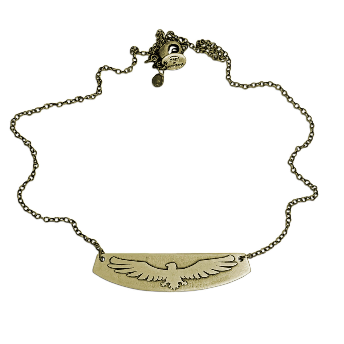 Freebird Necklace showcasing solid brass pendant with eagle design on an adjustable cable chain.