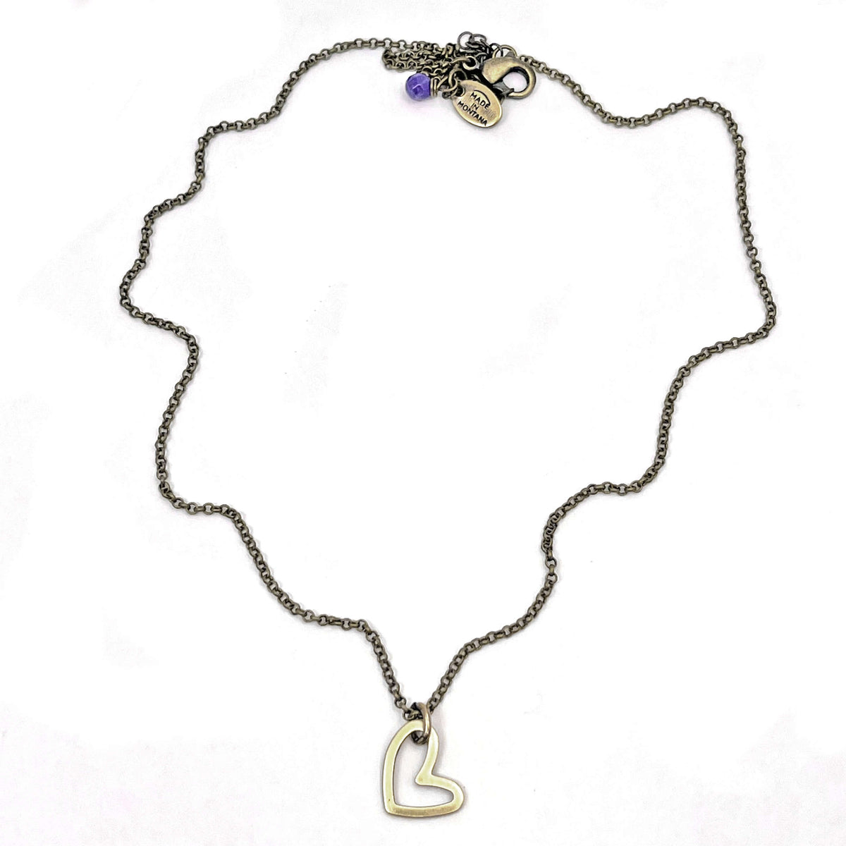 Open Heart Necklace showcasing a delicate open heart pendant on a simple chain, handmade in Montana.