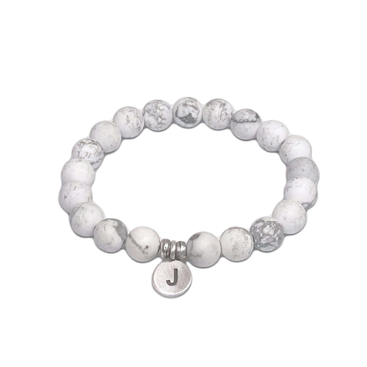 Initial Stretch Bracelet Collection featuring a personalized white Howlite bracelet with initial J disk.