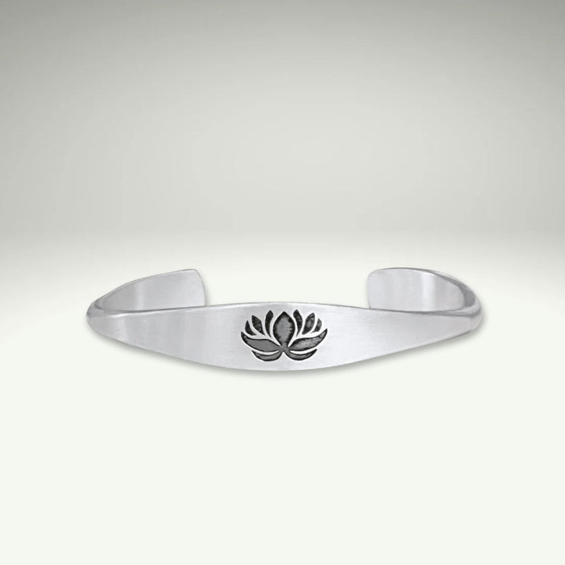 a silver bracelet with a flower on it