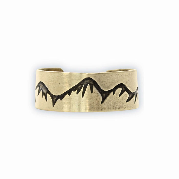 Snowcaps Adjustable Ring with mountain design etched in raw brass finish.