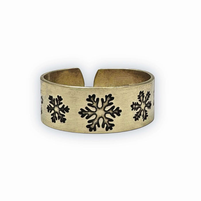 Snowfall Adjustable Ring featuring intricate snowflake designs in Antique Brass finish.