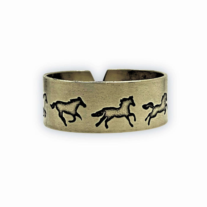 Wild Horses Adjustable Ring featuring galloping horse designs on a matte brass finish.