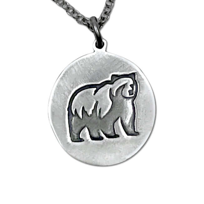 Griz necklace pendant in matte silver featuring a grizzly bear design on a rolo chain, handmade in Montana.