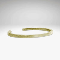 All Square Cuff Bracelet in Antique Brass finish on a soft gradient background.