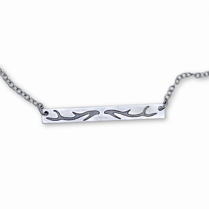 Sleek Antler Bar Necklace crafted with an acid-free etching process, adjustable 16" to 18" chain.