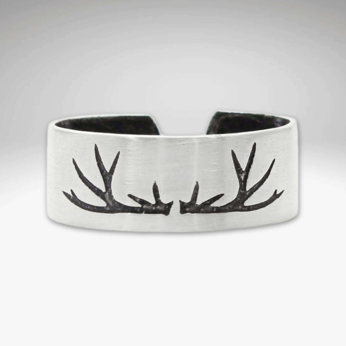 Antlers Adjustable Ring showcasing a handcrafted antler design in matte silver finish, ideal for nature enthusiasts.