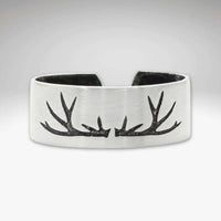 Antlers Adjustable Ring showcasing a handcrafted antler design in matte silver finish, ideal for nature enthusiasts.