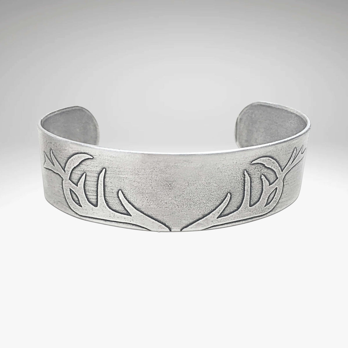 Antlers Cuff Bracelet in Matte Silver finish, showcasing unique etching of antlers, perfect gift for wildlife lovers.
