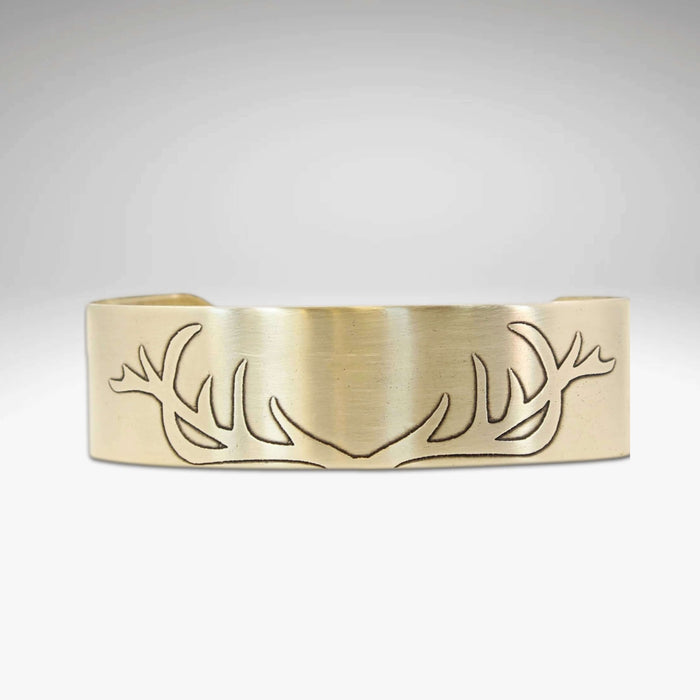 Antlers Cuff Bracelet featuring a unique antler etching design in a matte silver finish.