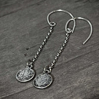 Asteroids Earrings featuring textured raw brass disks and oxidized rolo chain, perfect for any accessory collection.
