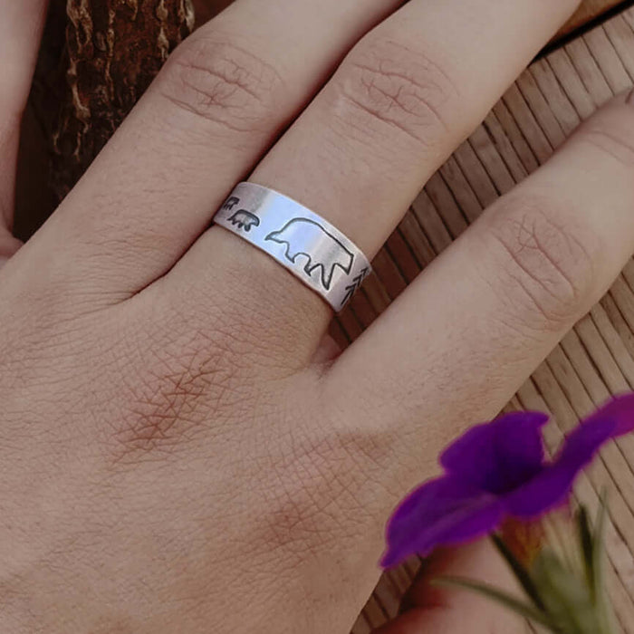 Hand wearing a Bear Family Adjustable Ring, showcasing mama bear and cubs design in elegant matte silver finish.