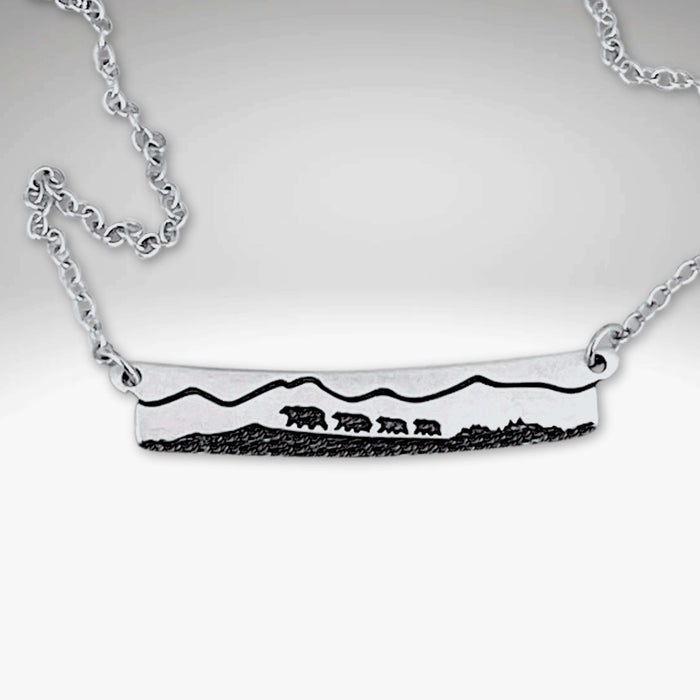Bear Family Necklace featuring a hand-drawn design of a mama bear and cubs on a matte silver bar.