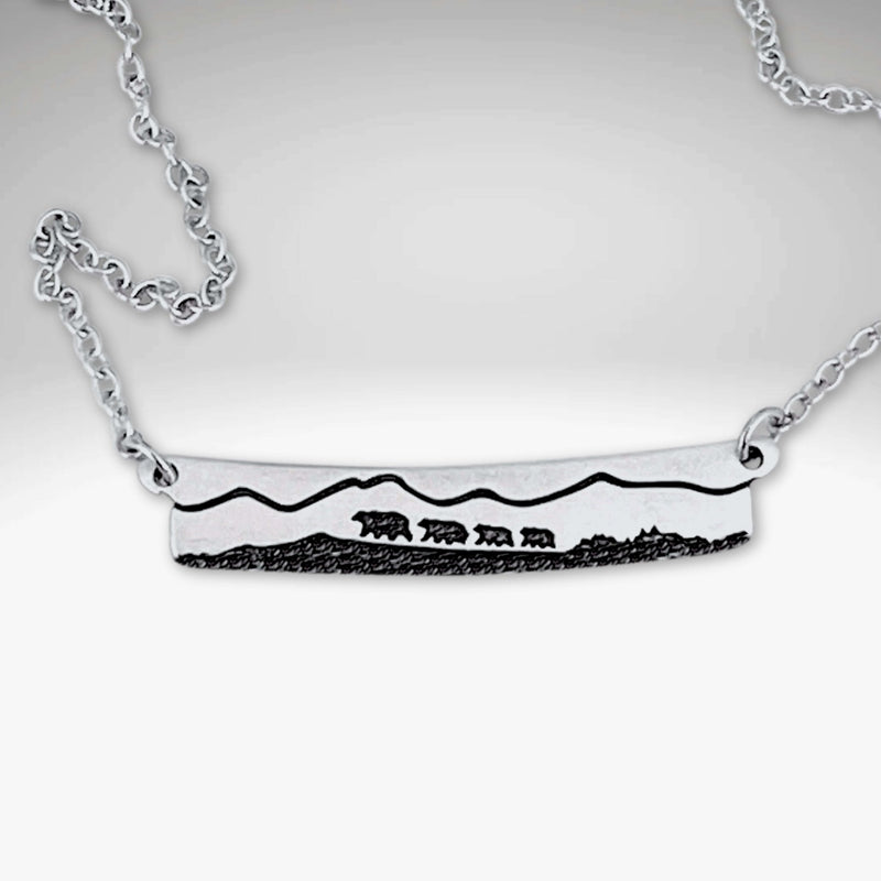 Bear Family Necklace featuring a hand-drawn design of a mama bear and cubs on a matte silver bar.