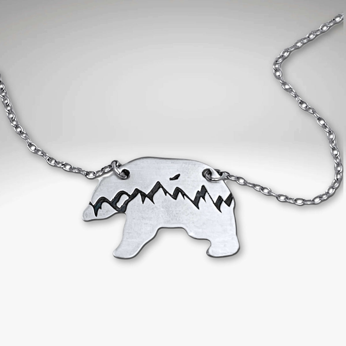 Bears in the Mountains Necklace featuring a bear silhouette with mountain design on an 18" cable chain.