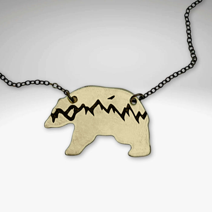 Bears in the Mountains Necklace featuring a bear silhouette with mountain design on an 18' cable chain.