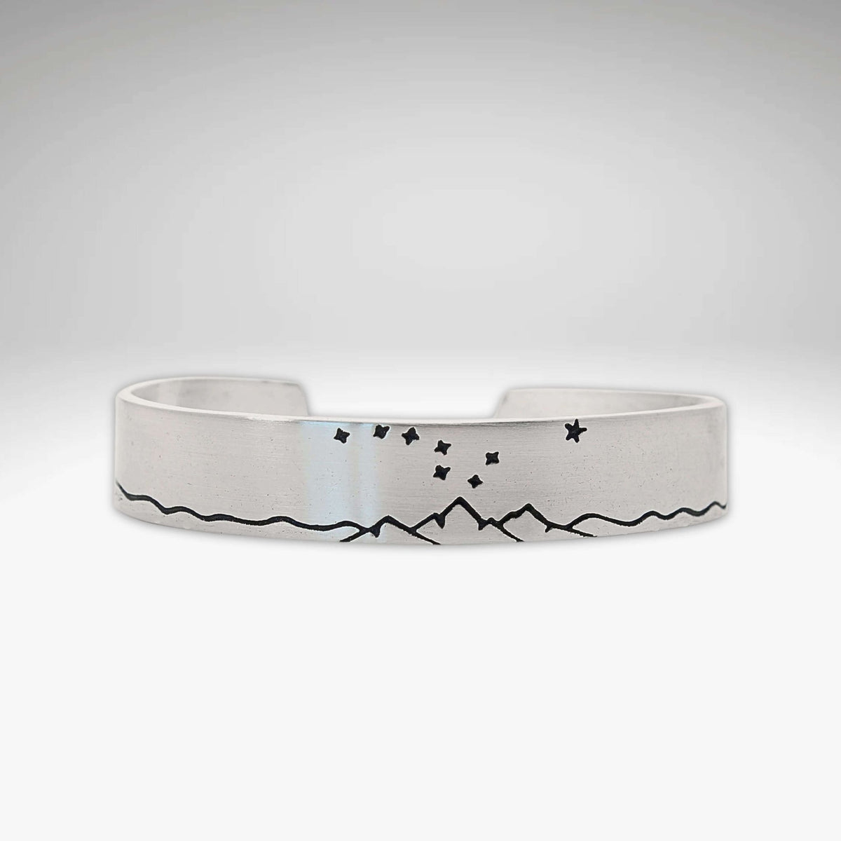 Big Dipper Cuff Bracelet featuring mountains and stars, capturing the beauty of the night sky.