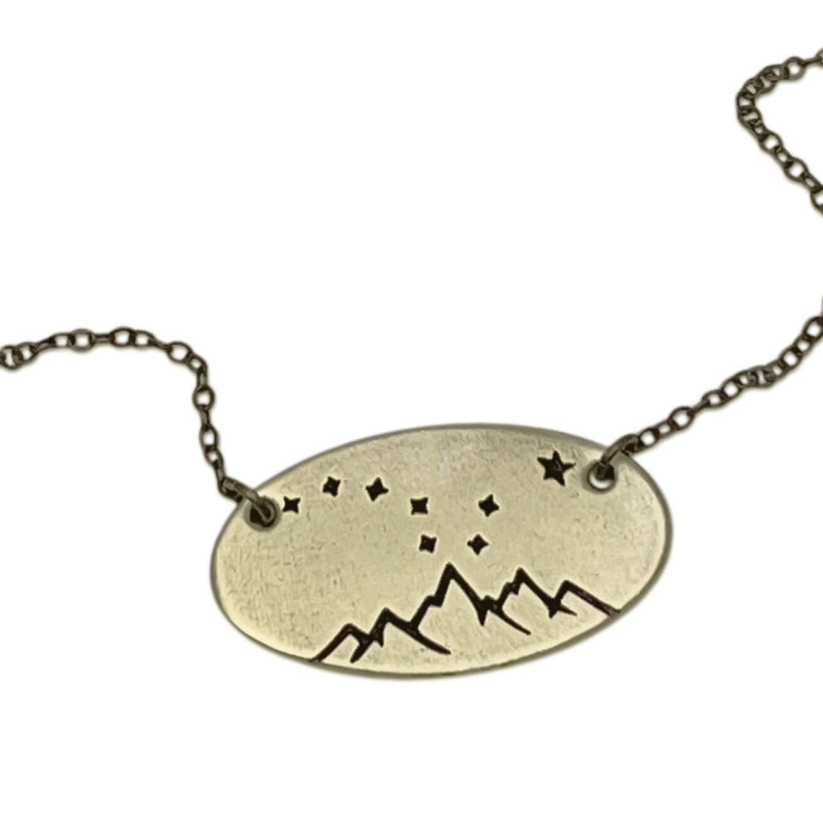 Big Dipper Necklace featuring mountains and stars on a delicate chain, a reminder of the night sky.