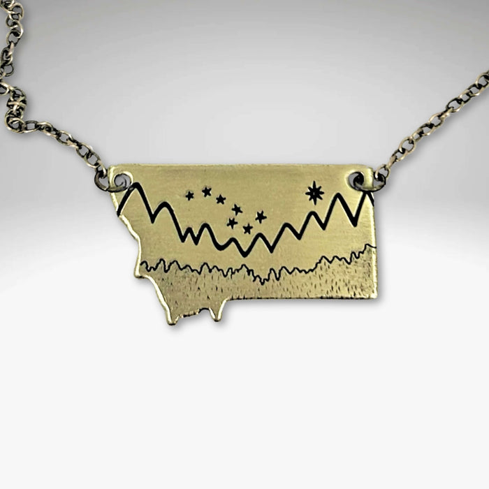 Big Dipper Over Montana Necklace featuring mountain outline and stars in Montana silhouette.