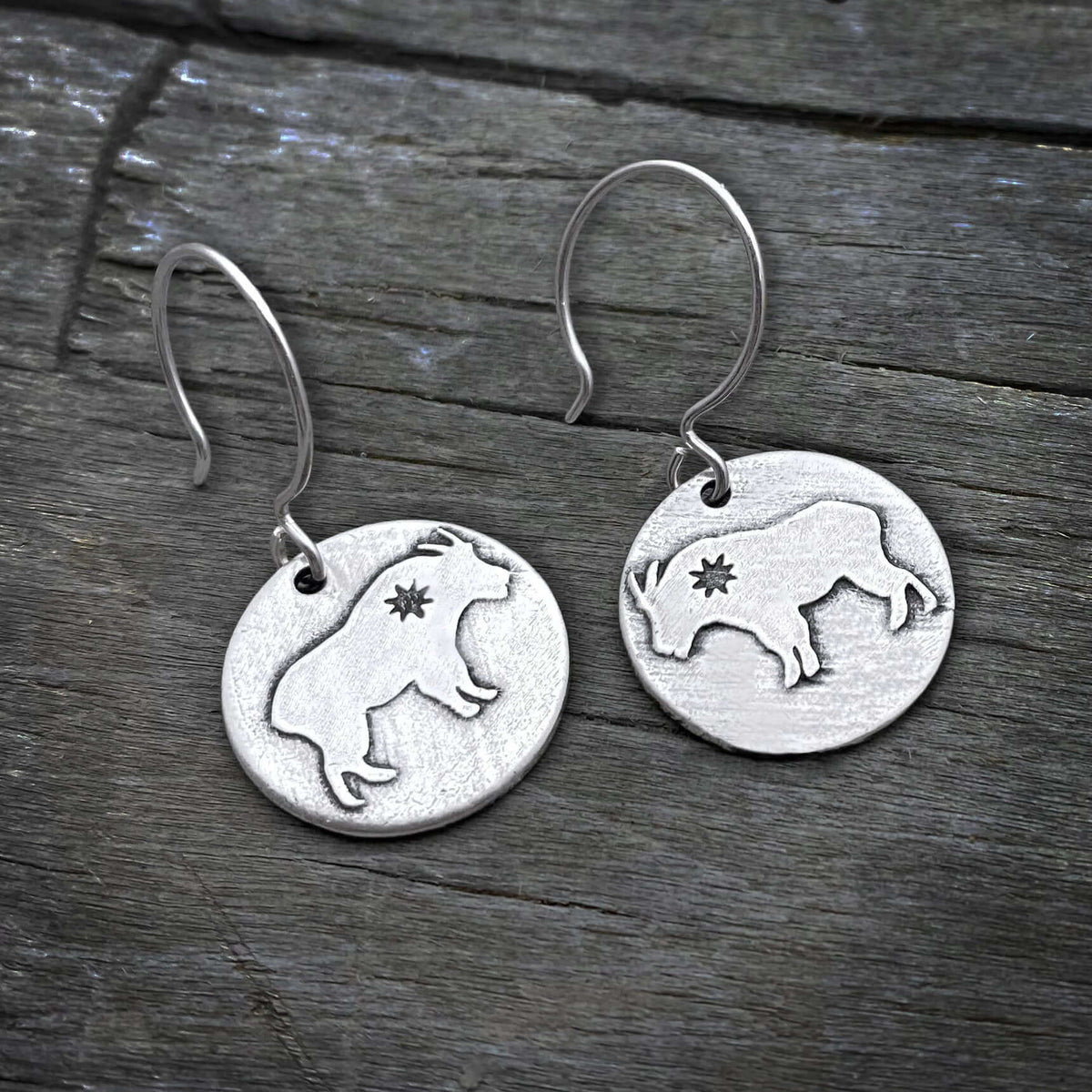 Billy Goat Earrings with unique etched design and tiny star, featuring sterling silver earwires.