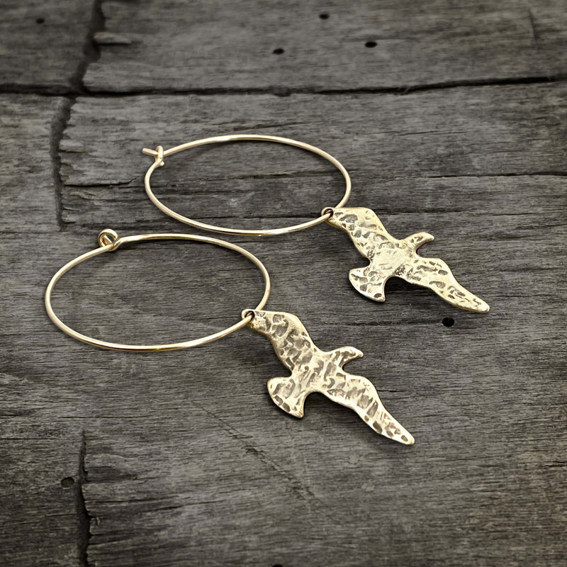 Birds on a Wire Hoop Earrings featuring gently hammered birds in antique brass finish.
