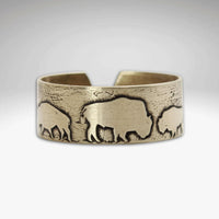 Bison Circles Adjustable Ring featuring bison motifs in antique brass finish.