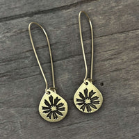 Bitterroot Drop Earrings featuring unique kidney earwire in Antique Brass finish, teardrop design with floral details.