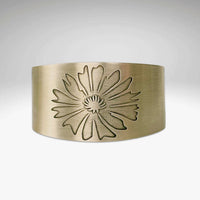Bitterroot Flower Cuff Bracelet in antique brass finish featuring a floral design, handmade in Montana.