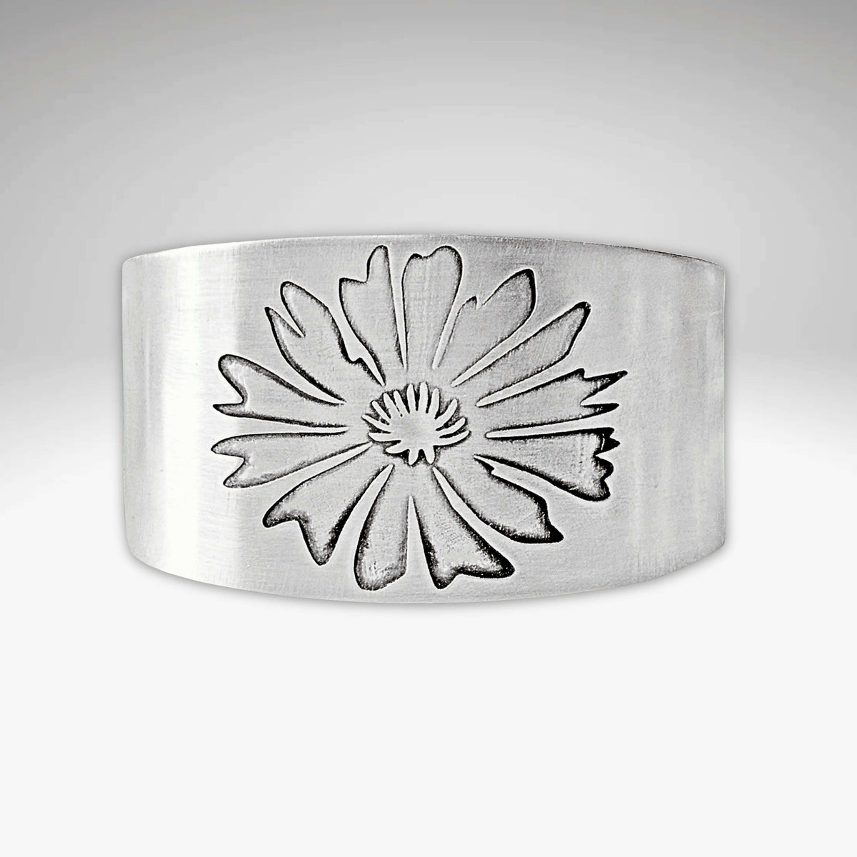 Bitterroot Flower Cuff Bracelet in matte silver with intricate floral design, adjustable, handmade in Montana.
