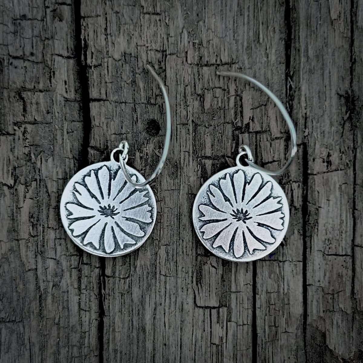 Bitterroot Flower Earrings in Matte Silver finish, featuring a detailed floral design on circular disks.