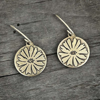 Bitterroot Flower Earrings in matte silver finish showcasing a beautiful flower design on circular disks.