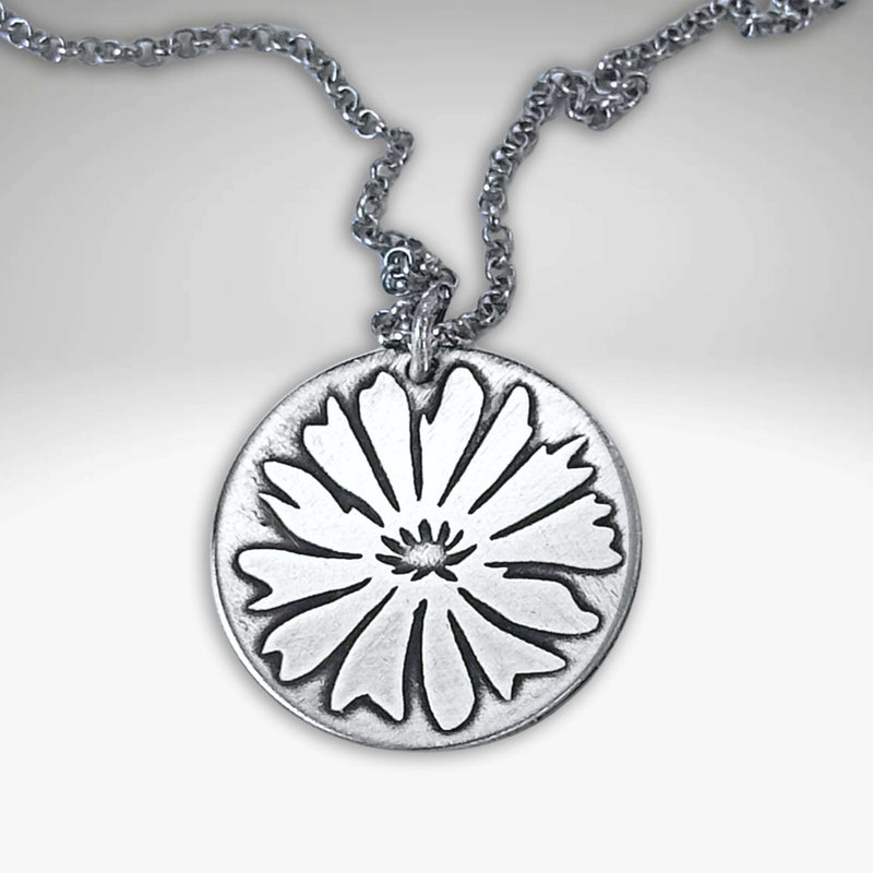 Bitterroot Necklace featuring a fine line etched bitterroot flower pendant in matte silver finish.