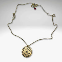 Bitterroot Necklace featuring a big bitterroot flower pendant on an antique brass chain.