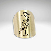 Blue Heron Adjustable Ring featuring a graceful etched blue heron design on a gold-tone surface.