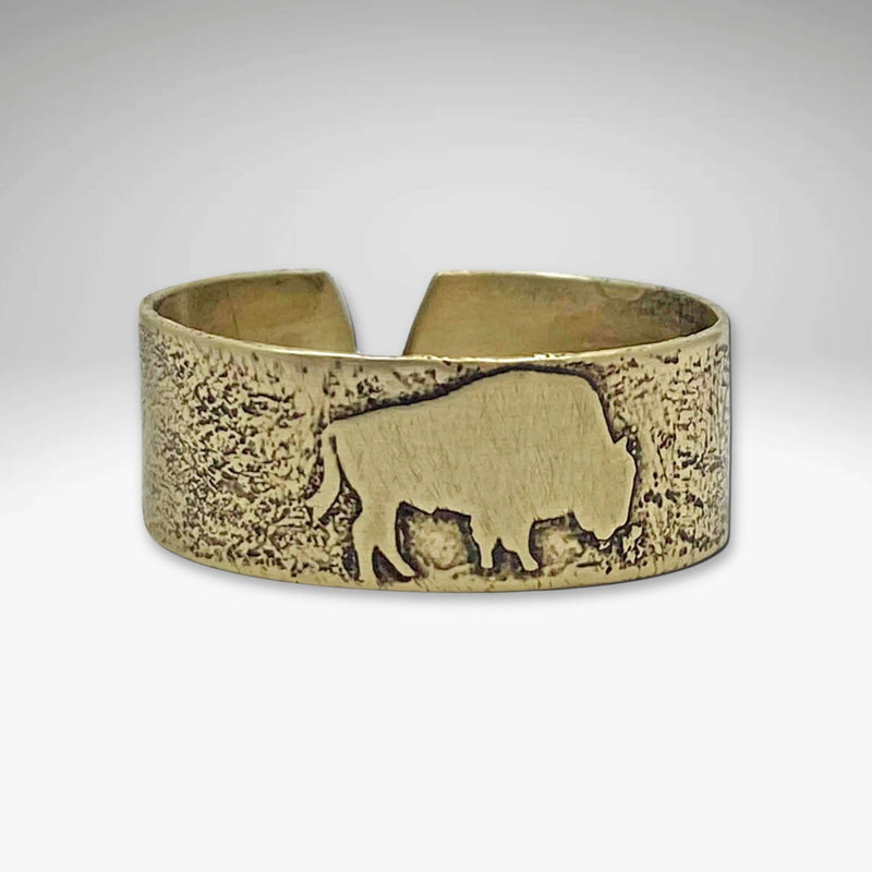 Buff Adjustable Ring in antique brass finish featuring a bison design, perfect for nature lovers and adjustable for any finger size.