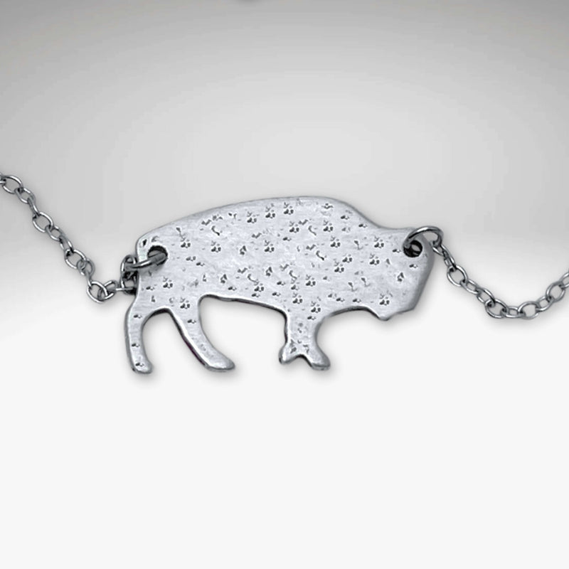 Buffalo Necklace featuring a hand-finished matte silver buffalo pendant on an 18" cable chain.