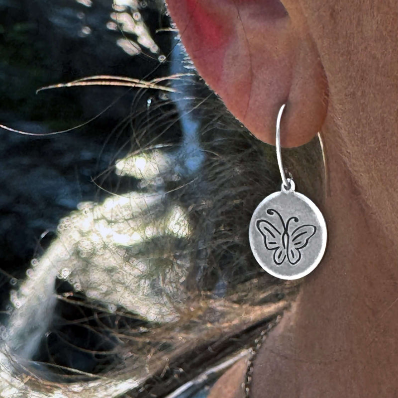 Close-up of Butterfly Earrings showcasing intricate butterfly design in silver, perfect for adding whimsy to any outfit.