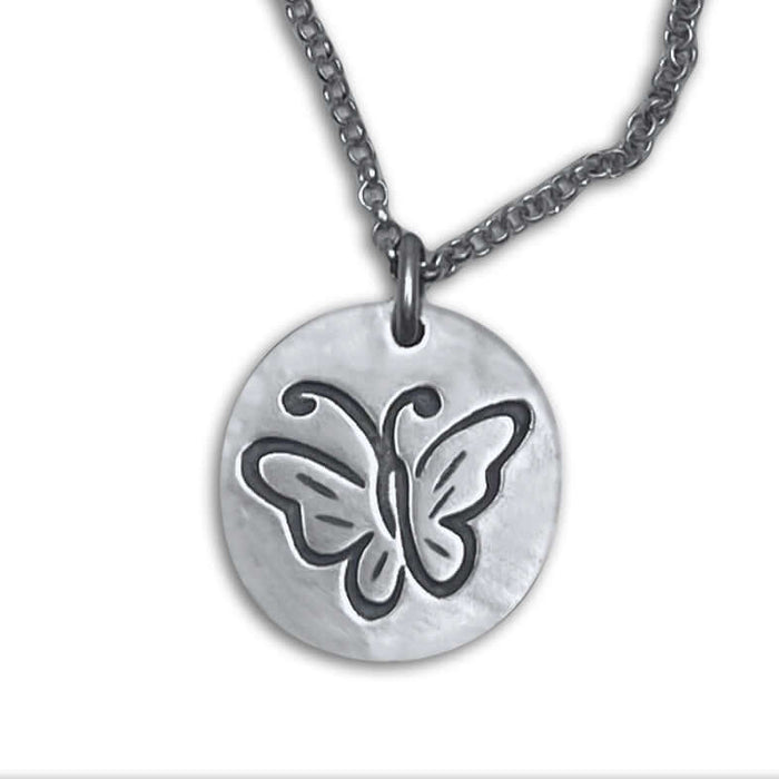 Butterfly necklace pendant featuring an etched butterfly design on a silver disc with an adjustable chain.
