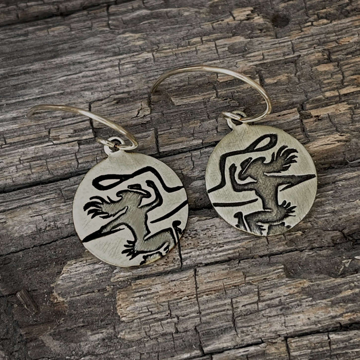 Cowgirl Earrings featuring etched cowgirl design on raw brass with simple earwires in matte silver or antique brass.